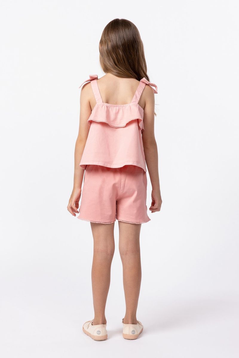 858024-Blusa-de-alca-em-sarja-com-laco-e-pompom-na-barra-do-babado-para-meninas